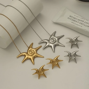 Golden and silver stainless steel starfish earrings and necklace set with spiral design