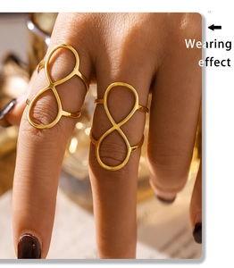 Detailed view of wide hollow infinity knot ring in 18K gold plated stainless steel
