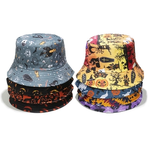 Halloween bucket hats with pumpkin and bat prints in stacked arrangements on white background
