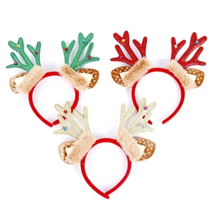 Three festive Christmas reindeer antler headbands in green, red, and gold plush fabric