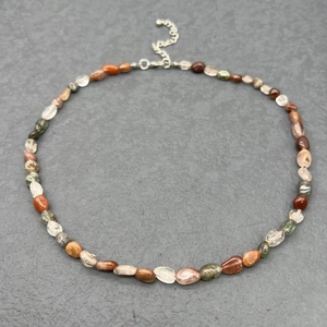 Detail of irregular natural stone necklace with stainless steel lobster clasp and chain