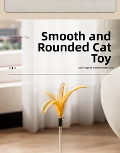 Detail of tumbler cat toy featuring yellow feather with bell and flexible spring rod