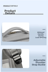 Detail of grey travel backpack showing widened mesh handle and adjustable plastic strap buckle