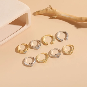 Detail view of 8pcs adjustable heart ring set with zircon accents and AMOR engraving