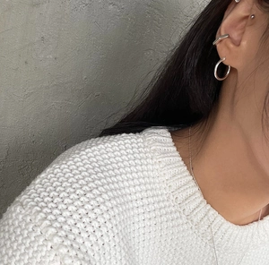 Minimalist 925 sterling silver hoop earrings and chain necklace on model side profile