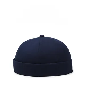 Detail view of navy blue cotton docker hat with six-panel design and retro rolled brim
