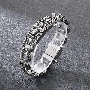 Detail of cross pattern and STAINLESS STEEL 316L hallmark on vintage chain bracelet