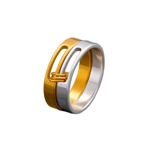 Detail of two-tone hollow stainless steel ring with elegant spiral wire decorative accents