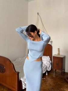 Light blue two-piece knit set featuring asymmetric top and maxi skirt for women