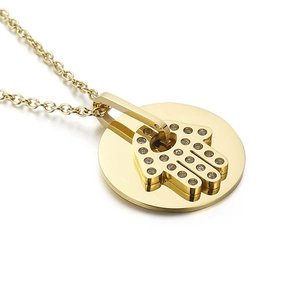 Golden double-layer necklace featuring Hamsa Hand pendant with sparkling zircon accents