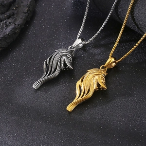 Vintage stainless steel viking wolf head necklaces in silver and gold on stone base