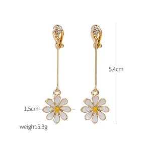 Detail showing 5.4cm daisy drop earrings with gold rod and crystal studs