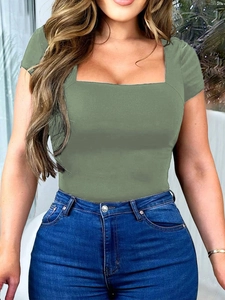 Detail of army green square neck slim fit T-shirt worn with blue denim jeans outdoors