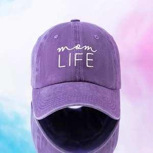 Close-up of purple washed cotton baseball cap with white mom LIFE embroidery detail