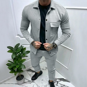 Detail of light gray twill knitted fabric on men's casual jacket with black buttons