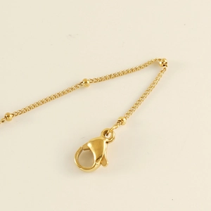 Chic gold-plated titanium steel anklet with side bead details and lobster clasp closure