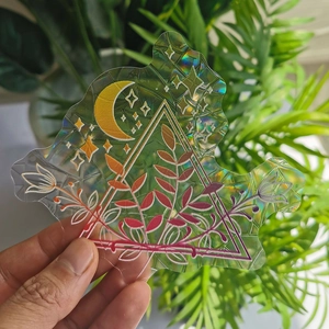 Detailed holographic suncatcher sticker featuring geometric leaves and moon prisms