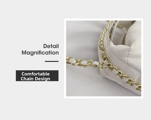 Detail magnification of comfortable white quilted leather and golden chain shoulder strap