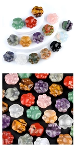 Close-up of polished amethyst and natural crystal cat paw figurines in multiple colors
