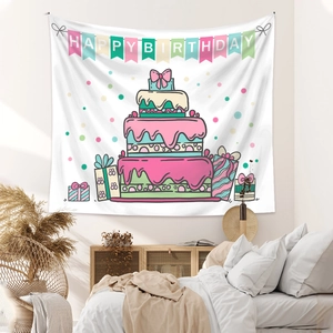 Detail of macaron-colored birthday tapestry with cake and gift box patterns in a bedroom