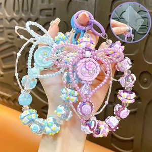 Bijou de Téléphone Créatif en Acrylique Miroir Perlé Porte-clés Mignon Femmes Fait Main Fleur Nœud Pendentif Sac à Dos