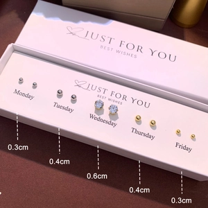 Detail of 5-pair minimalist stud earring set with gold, silver beads and cubic zirconia