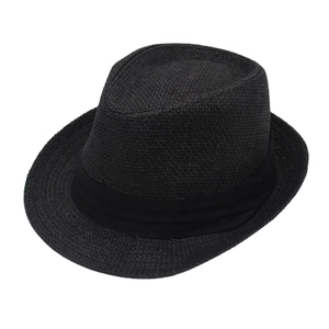 Detailed close-up of the fine weave texture on a black straw fedora with wide ribbon