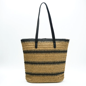 Large striped straw tote bag with black leather straps and zipper closure for beach