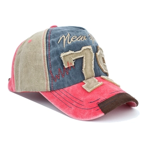 Detail of vintage denim baseball cap with distressed stitching and number 76 patch