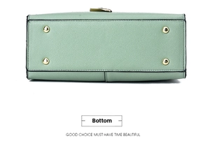 Detail of mint green leather bag bottom with four protective golden metal feet