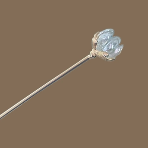 Elegant vintage gold lotus hair pin with crystal flower bud on brown background