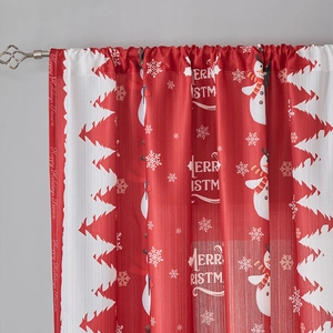 Detail of red Christmas curtain with snowman pattern and Merry Christmas text