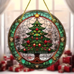 Close-up of stained glass style acrylic Christmas tree ornament with golden hanging cord