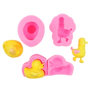 Detailed view of pink silicone molds for 3D duck shapes with textured craft finish