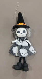 Detailed view of Halloween witch skeleton hanging ornament with black hat and printed dress