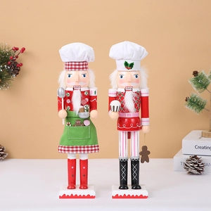 Detailed pair of wooden Christmas nutcracker chefs with cooking utensils and festive decor