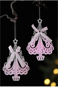 Detail of pink acrylic Christmas tree ornaments with glitter finish and ribbon bows