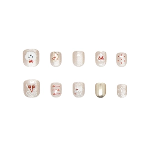 Set di unghie finte artigianali con glitter champagne, cani carini e fiocchi rossi