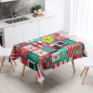 Detail of Christmas tablecloth featuring reindeer, snowman, and gift box festive patterns
