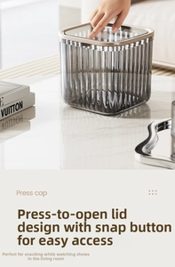 Macro view of translucent gray desktop trash bin with one-click press cap lid design