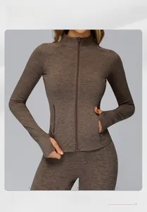 Detail of female sports jacket with functional thumb holes and brushed gray texture