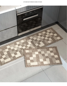 Detail of geometric kitchen rug set showing woven texture and anti-slip backing in a kitchen