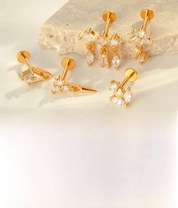 Detail of 5pcs gold titanium star and teardrop zircon labret stud set 1.2x8mm size
