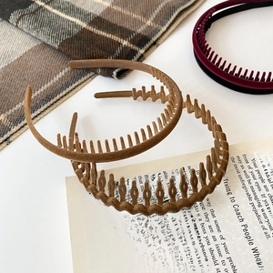 Detail of non-slip velvet headband set in rich autumn colors for hair styling