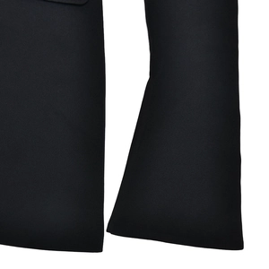 Detailed close-up of high-quality black fabric texture and material on a dress
