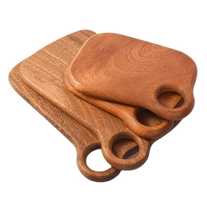 Three-piece solid ebony wood cutting board set with circular handle holes and round edges