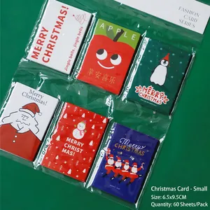 Detail view of 60-piece Christmas gift tags set featuring Santa and snowman illustrations