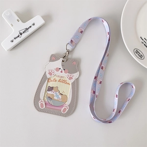 Detail of cartoon kitten PU leather card holder with fish pattern lanyard and clear window
