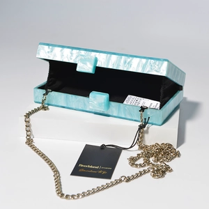 Blue marble acrylic clutch bag with gold chain strap for wedding and party wear