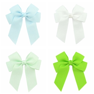 Set of four handmade grosgrain ribbon hair bows in blue, white, and mint green colors